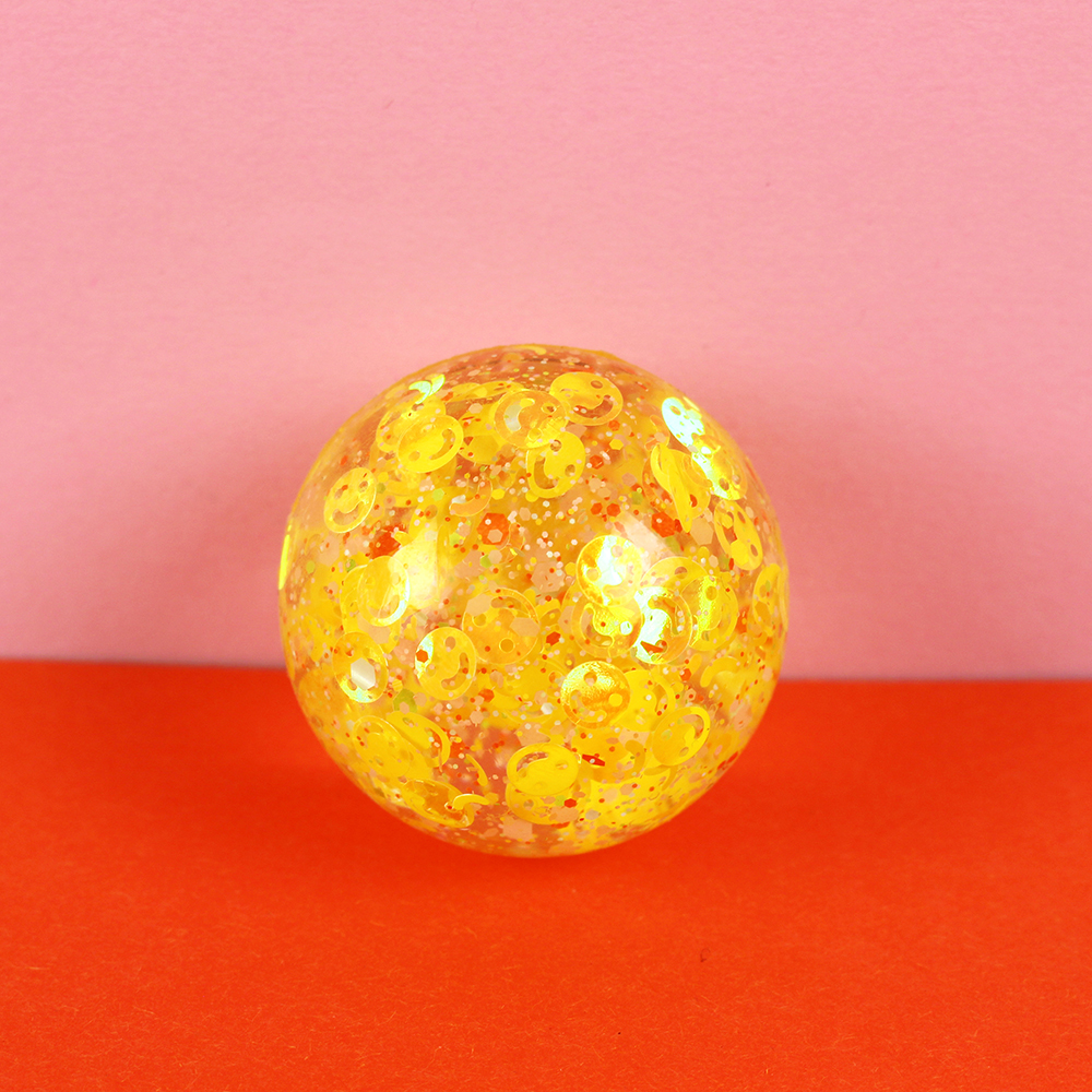Flummiball mit Smileys und Konfetti, gelb 49 mm