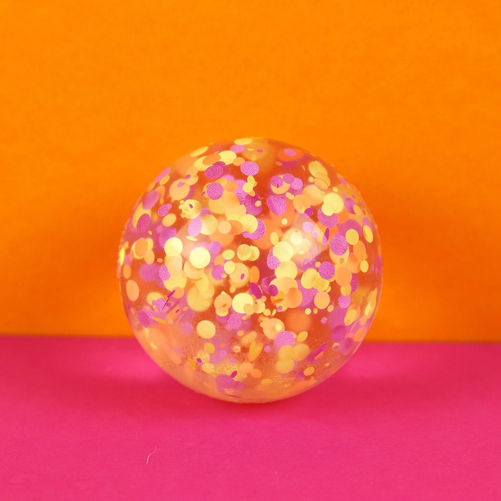 Flummiball mit Konfetti, lila/gelb/apricot 49mm